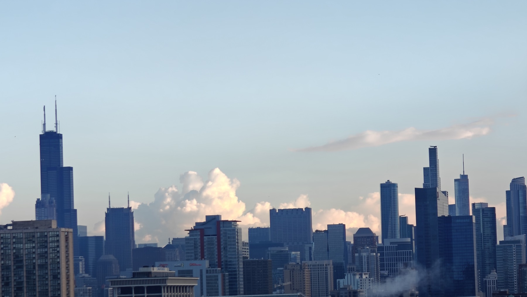 city skyline under clouds
